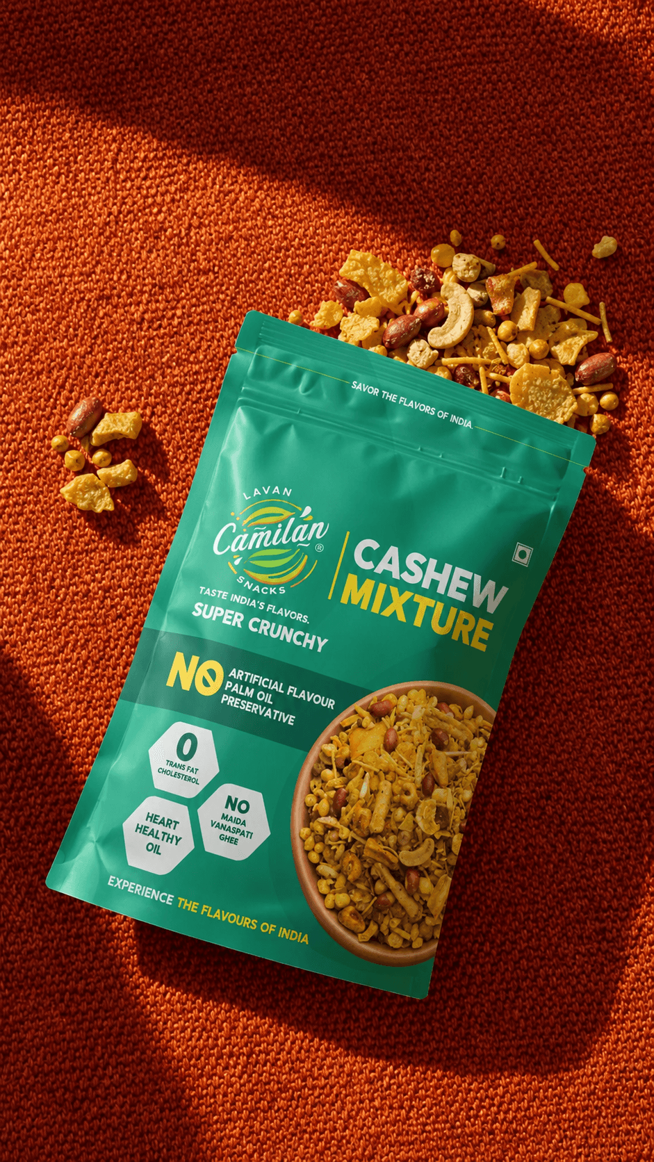Cashew Mixture pouch flat-lay on orange knit fabric with spilled mixture
